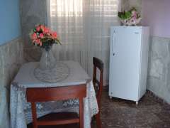 Dinig room with a refrigerator